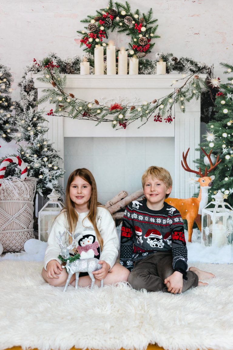 Christmas studio portrait of a young boy and girl