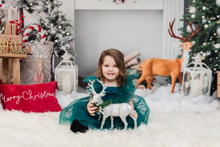 A young girl at a Christmas themed studio photography session