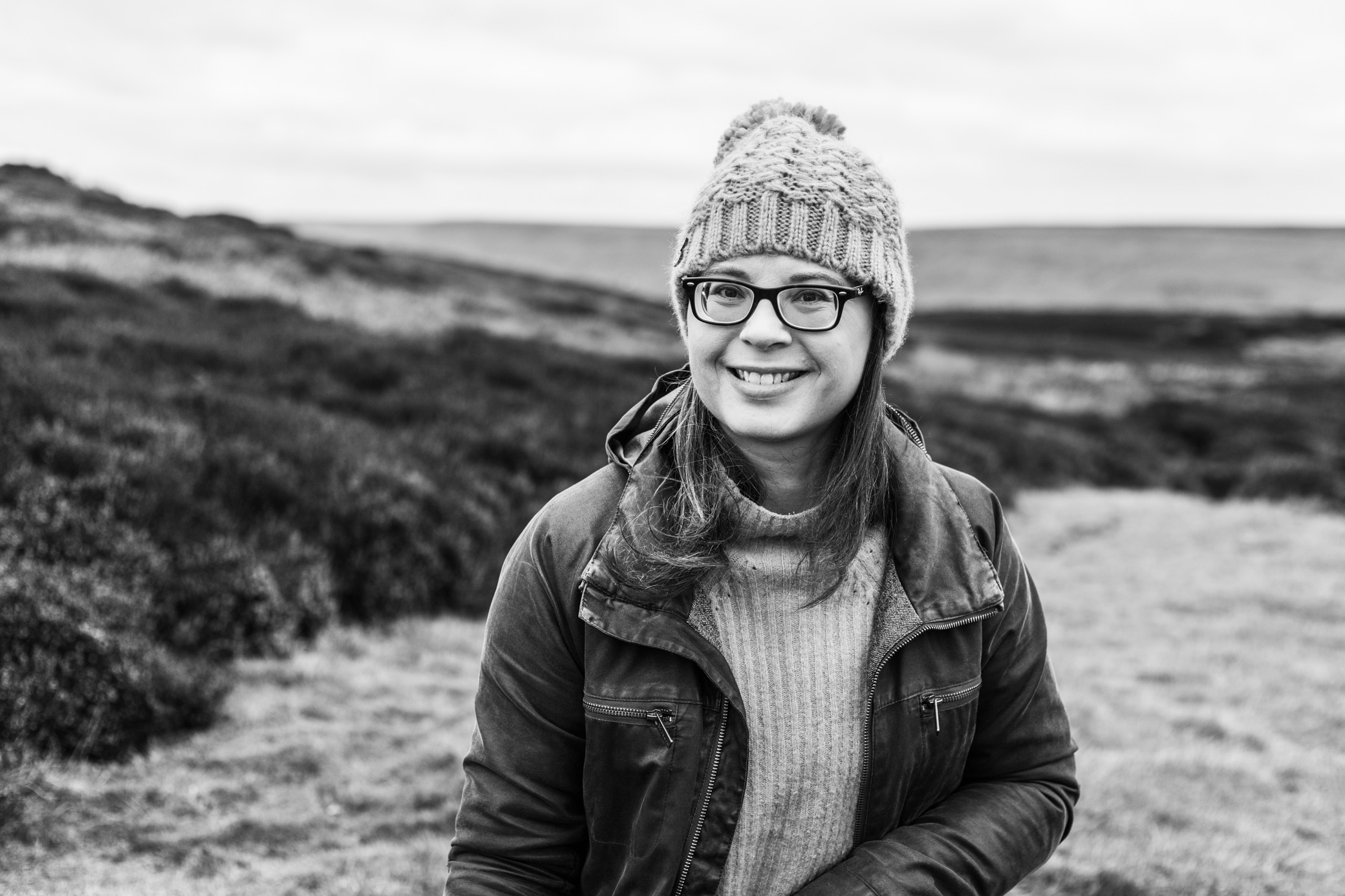 Black and white photo of Katy Howe on the moors in winter