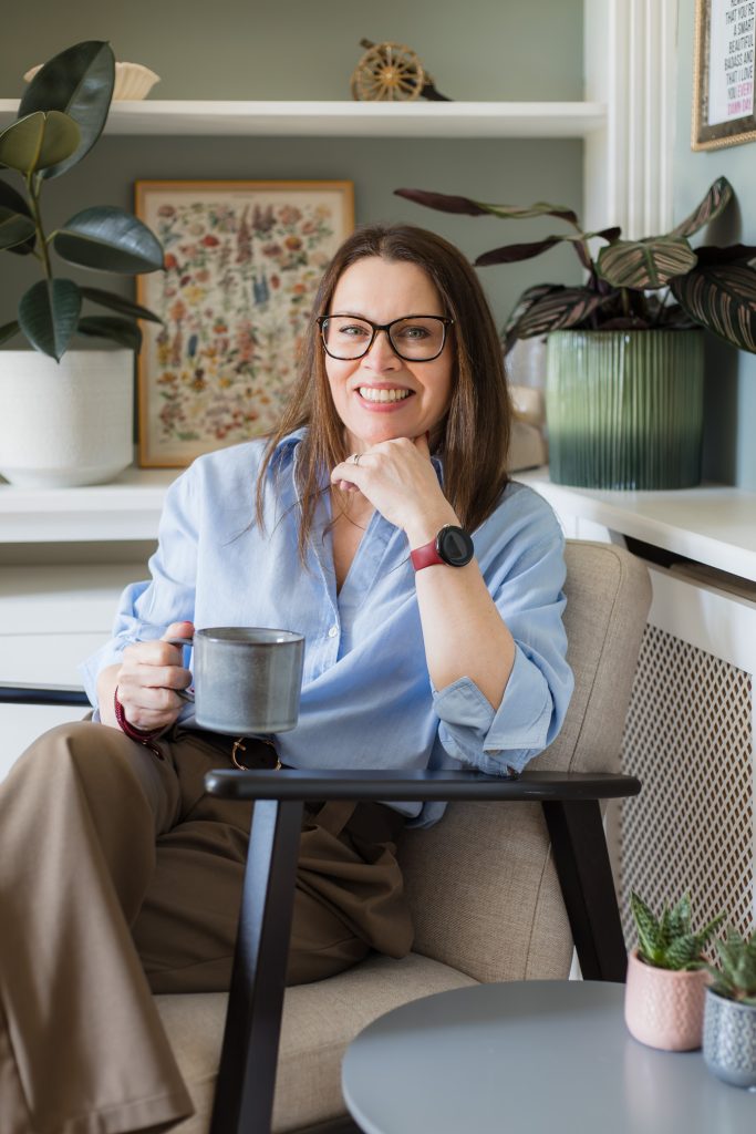 Portrait of a business women sitting in a relaxed chair in a home office.